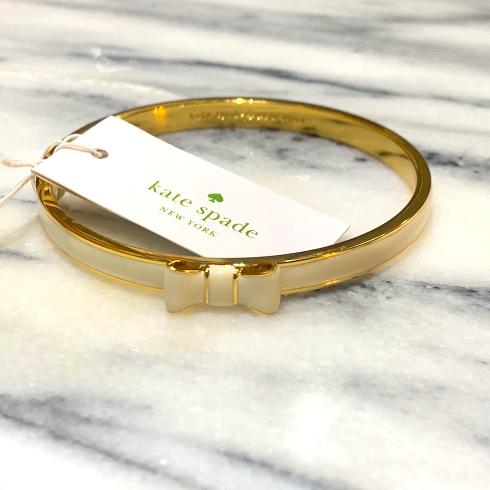 Kate spade Take a bow white and gold bracelet bangle